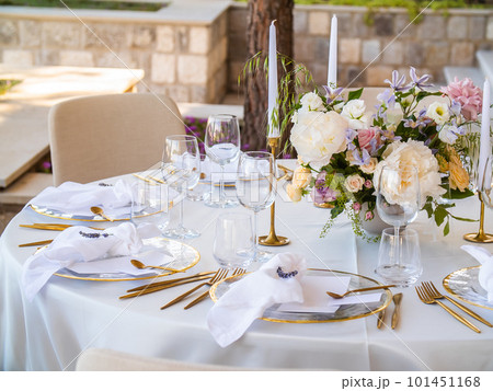 Luxury elegant wedding reception table arrangement and floral centerpiece - wedding banquet and event outdoor Luxury elegant wedding reception table arrangement and floral centerpiece - wedding banquet and event outdoor 101451168