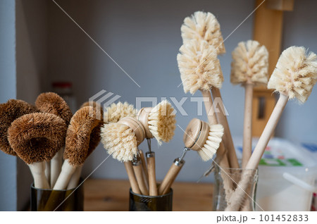 Eco brushes made of coconut. Household products without plastic waste in an eco friendly store Eco brushes made of coconut. Household products without plastic waste in an eco friendly store 101452833