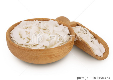 Coconut flakes or chips in wooden bowl isolated on white background with full depth of field 101456373
