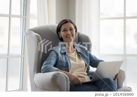 Happy pretty mature freelance professional woman home portrait Happy pretty mature freelance professional woman home portrait 101456900