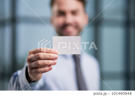 Businessman showing a blank business card, close-up Businessman showing a blank business card, close-up 101460948