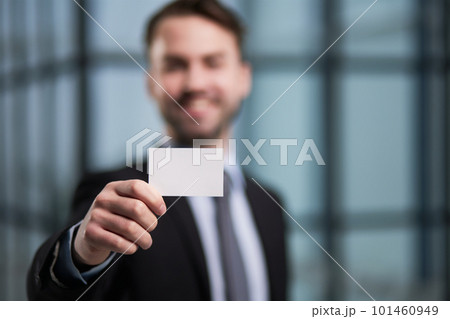 Man's hand showing business card - closeup shot Man's hand showing business card - closeup shot 101460949