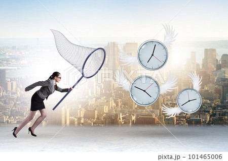 Deadline concept with businesswoman catching clocks Deadline concept with businesswoman catching clocks 101465006