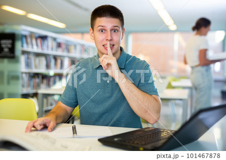 Young male student tricky silence hushing easy 101467878