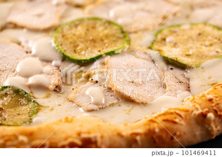 Closeup on chicken pizza with zucchini 101469411
