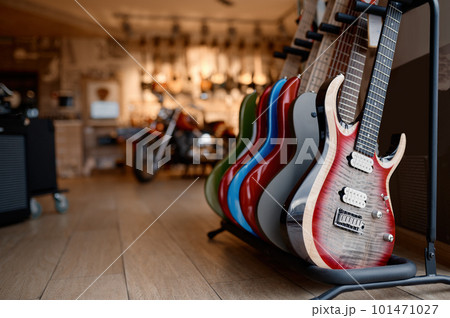 Electric guitar display at studio shop with big assortment of string instrument 101471027