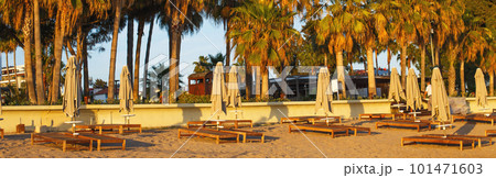 beach scene in Side Turkey with empty umbrellas and sun loungers. Vacation at the sea. Summer holidays. 101471603