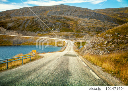Driving a car on road in tundra. Nature of Norway. Polar circle. The way to Nordkapp 101471604
