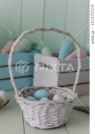 bucket with painted eggs for Easter basket background for the holiday bucket with painted eggs for Easter basket background for the holiday 101475319