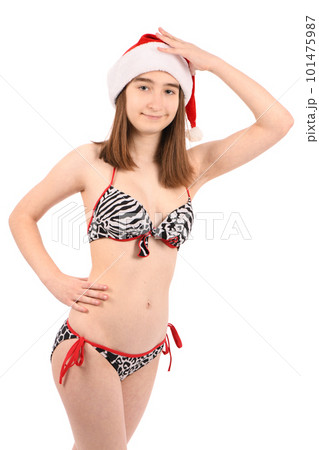 Young beautiful girl in a bathing suit isolated on a white background. Young beautiful girl in a bathing suit isolated on a white background. 101475987