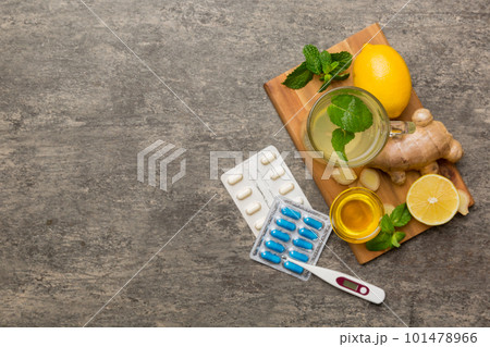 Natural cold and flu home remedies. Natural ingredients for immunity stimulation and viruses protection. top view flat lay Natural cold and flu home remedies. Natural ingredients for immunity stimulation and viruses protection. top view flat lay 101478966