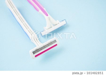 The Pink Razors on blue color Background. The Pink Razors on blue color Background. 101482851