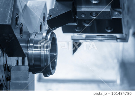 The  CNC lathe machine forming  cutting the metal parts. 101484780