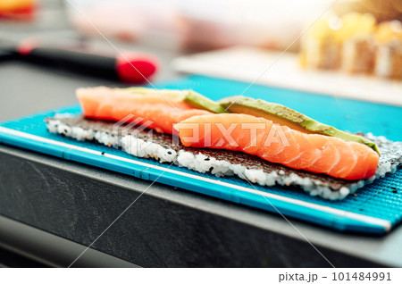 Close up of tasty japanese uramaki sushi with salmon Close up of tasty japanese uramaki sushi with salmon 101484991