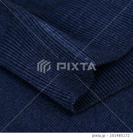 Knitted elastic band on navy blue wool jumper close up Knitted elastic band on navy blue wool jumper close up 101485172