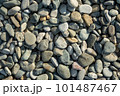 Different color beach stone pebbles at seashore outdoors top view. Abstract smooth round pebbles sea 101487467