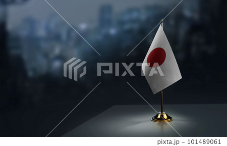 Small flags of the Japan on an abstract blurry background 101489061