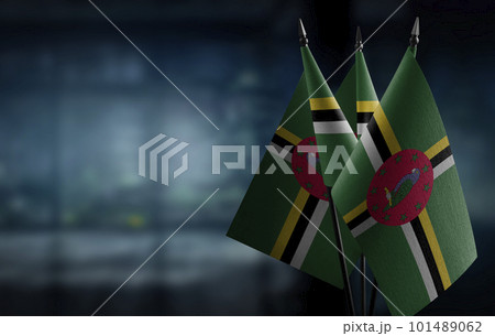 Small flags of the Dominica on an abstract blurry background Small flags of the Dominica on an abstract blurry background 101489062