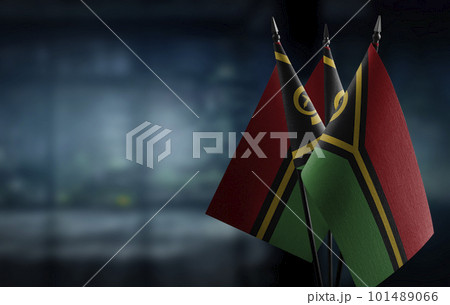 Small flags of the Vanuatu on an abstract blurry background 101489066