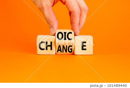 Choice and change symbol. Concept word Choice Change on wooden cubes. Businessman hand. Beautiful orange table orange background. Business and choice and change concept. Copy space. Choice and change symbol. Concept word Choice Change on wooden cubes. Businessman hand. Beautiful orange table orange background. Business and choice and change concept. Copy space. 101489440