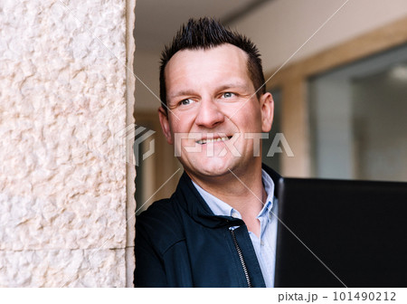 A confident business person with a laptop in the city. Business vision, communications, online shopping A confident business person with a laptop in the city. Business vision, communications, online shopping 101490212