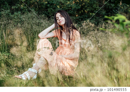 Ways To Unplug From Technology and Be Present. Unplugging from Technology and Living a More Mindful Life. Outdoor portrait of young woman enjoying nature Ways To Unplug From Technology and Be Present. Unplugging from Technology and Living a More Mindful Life. Outdoor portrait of young woman enjoying nature 101490555