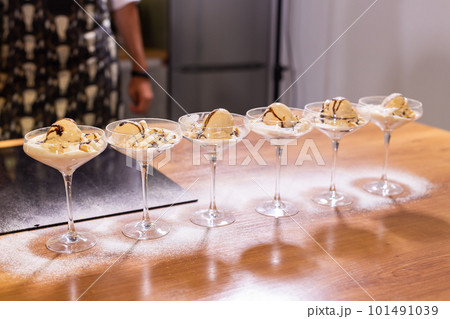Tasty ice cream dessert made from chocolate and vanilla in glass bowl Tasty ice cream dessert made from chocolate and vanilla in glass bowl 101491039