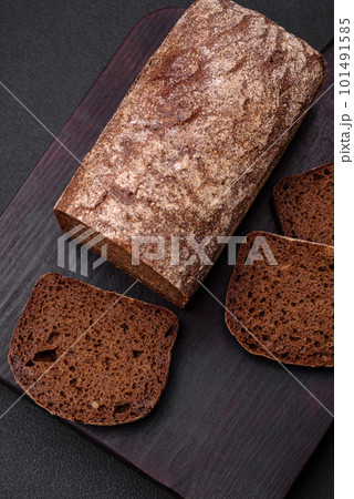 Loaf of fresh crispy brown bread with grains and seeds 101491585