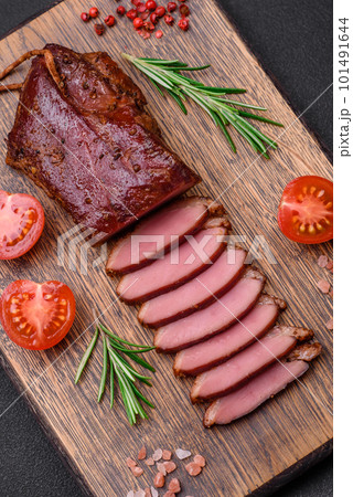 Delicious duck fillet or breast grilled or smoked with spices and salt Delicious duck fillet or breast grilled or smoked with spices and salt 101491644
