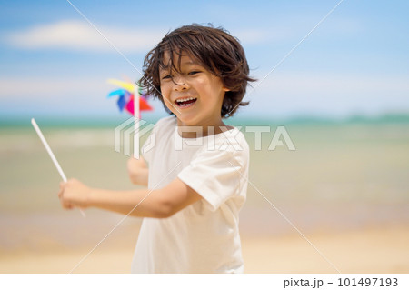 Happy child playing and running on sandy beach Happy child playing and running on sandy beach 101497193
