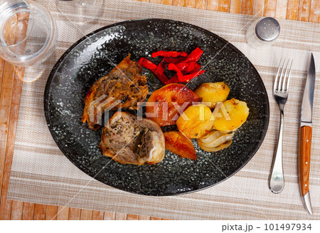 Lamb leg steaks with fried potatoes and baked red pepper Lamb leg steaks with fried potatoes and baked red pepper 101497934