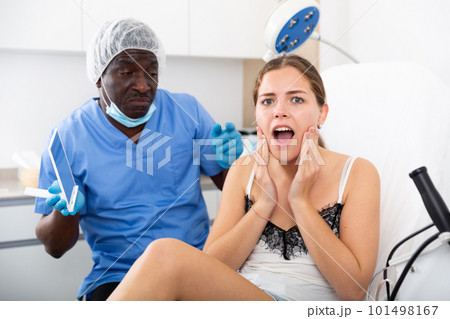 Portrait of unhappy worried woman after cosmetological procedure Portrait of unhappy worried woman after cosmetological procedure 101498167