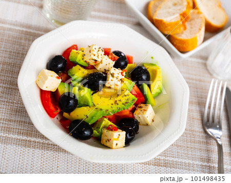 Salad with cheese, black olives and avocado 101498435