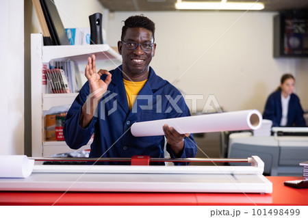 Typography technician offering plotter paper roll Typography technician offering plotter paper roll 101498499