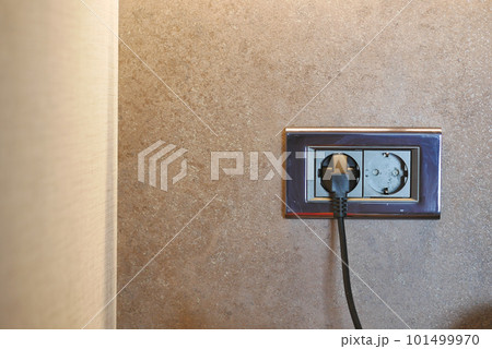 Electrical switch and plug on table Electrical switch and plug on table 101499970