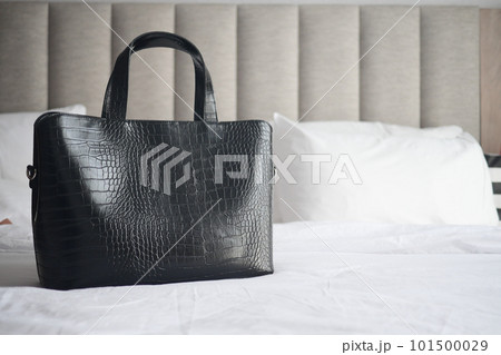 women purse wallet on bed, close up. women purse wallet on bed, close up. 101500029