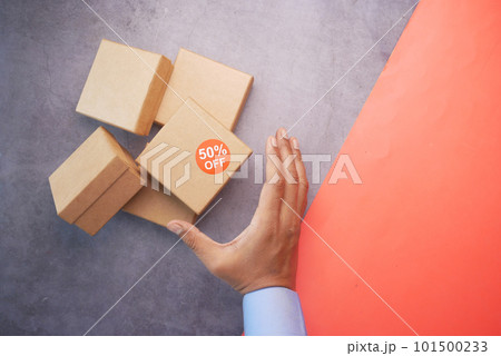 top view of 50 percent discount sign on a box on table  101500233