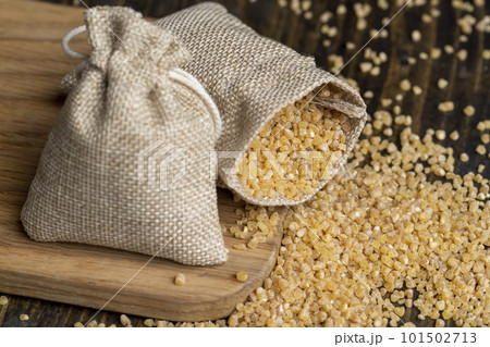 Not cooked wheat porridge in a linen bag 101502713