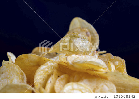 thin potato chips with spices, close up thin potato chips with spices, close up 101508142