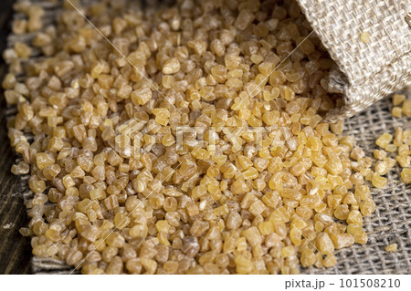 Not cooked wheat porridge in a linen bag 101508210
