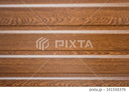 Brown steel background. Corrugated metal sheet texture background. Close up Texture. Corrugated reddish-brown iron sheet background close up. Blurred. Out of focus 101508376