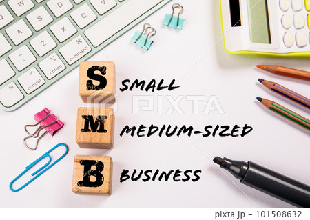 SMB - Small and Medium-Sized Business. Wooden blocks on a white office table SMB - Small and Medium-Sized Business. Wooden blocks on a white office table 101508632