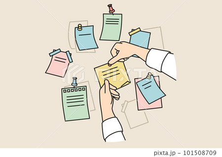 Person attach sticky notes to board  101508709