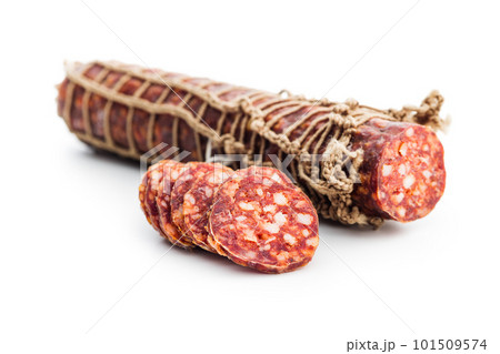 Smoked sausage. Sliced salami isolated on white background. 101509574