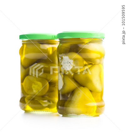 Peppers stuffed with cream cheese in jar isolated on white background. 101509595