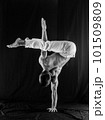 circus artist keeps balance on one hand isolated on a black background. Concept of individuality, creativity and self-confidence 101509809