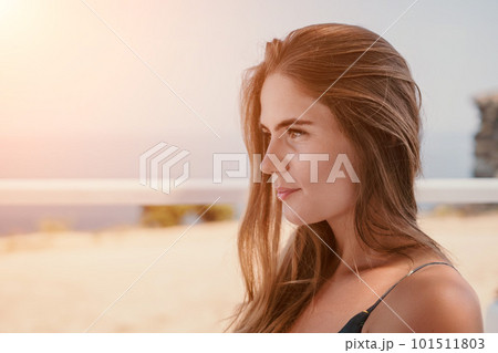 Happy woman portrait in cafe. Boho chic fashion style. Outdoor photo of young happy woman with long hair, sunny weather outdoors sitting in modern cafe. Happy woman portrait in cafe. Boho chic fashion style. Outdoor photo of young happy woman with long hair, sunny weather outdoors sitting in modern cafe. 101511803