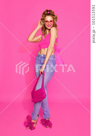 Portrait of stunning, young, beautyful woman wearing like sweet doll over pink studio background. Lady in pink sunlasses Portrait of stunning, young, beautyful woman wearing like sweet doll over pink studio background. Lady in pink sunlasses 101513591