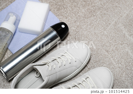 White leather shoe cleaning kit - water-repellent spray, foam, rag and sponge, copy space, place for text White leather shoe cleaning kit - water-repellent spray, foam, rag and sponge, copy space, place for text 101514425