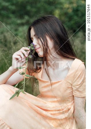 Ways To Unplug From Technology and Be Present. Unplugging from Technology and Living a More Mindful Life. Outdoor portrait of young woman enjoying nature 101517644